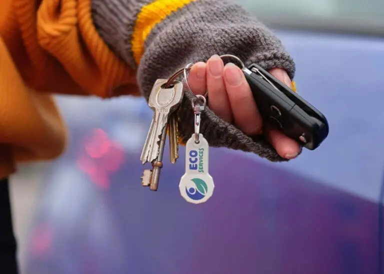 Branded biodegradable trolley stick keyring with printed logo attached to keys