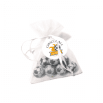 Promotional organza bag with chocolate footballs and logo printed round shaped label