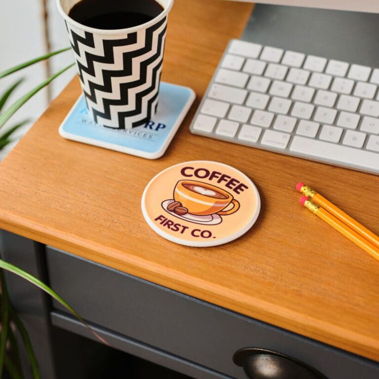 Promotional recycled circle coaster on desk with printed logo or design